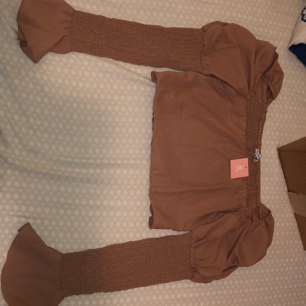 Tan crop shirt.